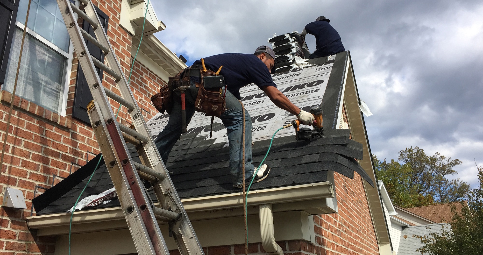 roofer installing shingles, roof installation
